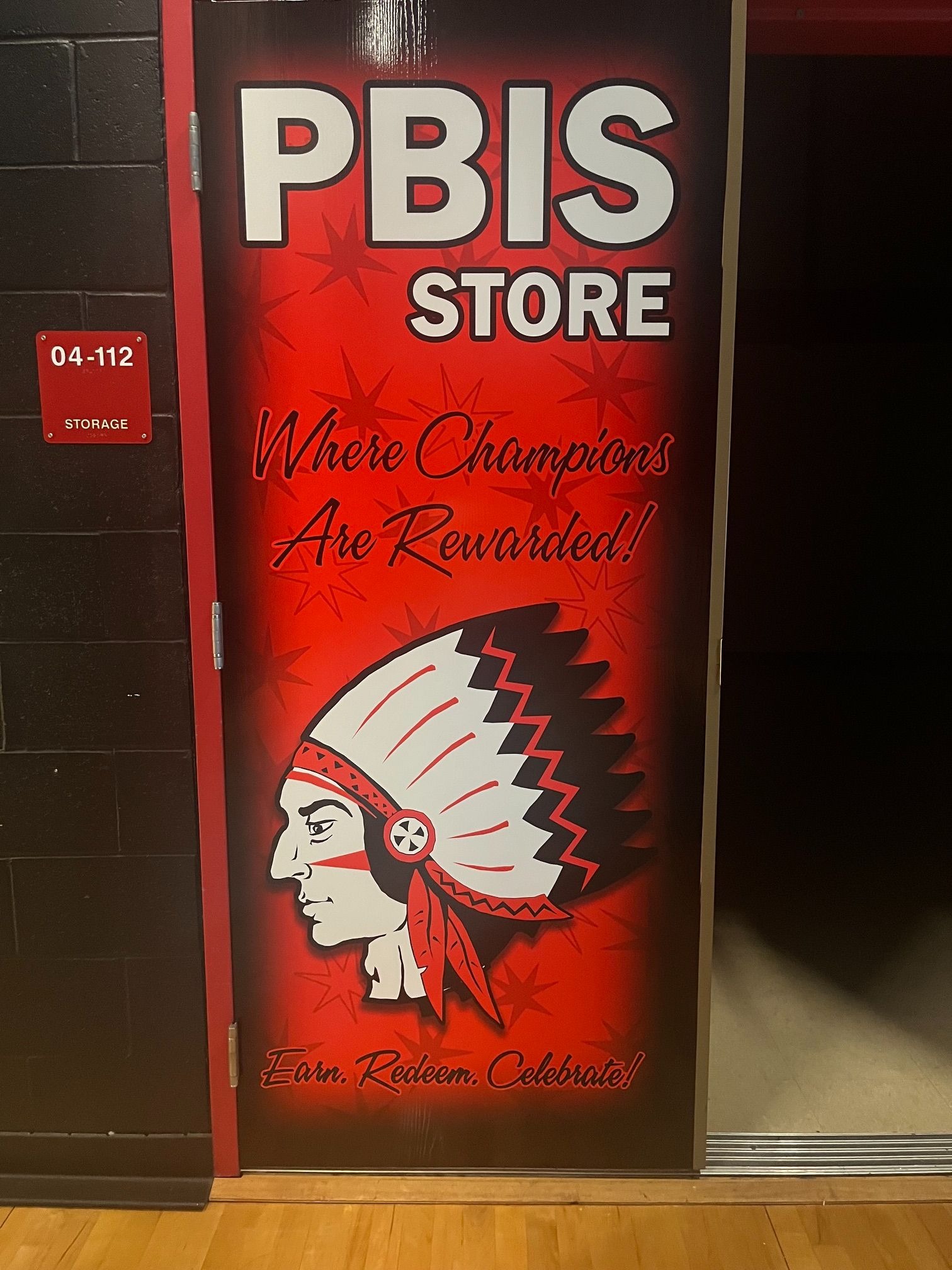 a sign that reads "PBIS Store. Where Champions are rewarded"